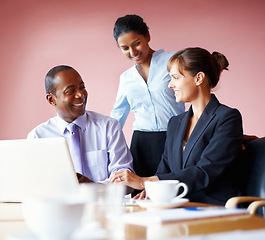 Image showing Collaboration, corporate people and meeting with a laptop in the boardroom for planning or strategy. Smile, teamwork or diversity with business men and women working on a computer for company vision