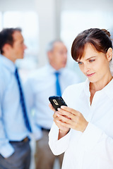 Image showing Business people, typing and woman with a smartphone, connection and internet with team, contact and deadline. Person, employee or agent with cellphone, mobile user and digital app with online reading