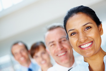 Image showing Smile, portrait of business woman with team in the office for positive, good and confident attitude. Happy, collaboration and professional young Indian female designer with people in workplace.