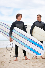 Image showing Surfer men, talking and friends at beach with smile, training and fitness on vacation in summer. Exercise, people and surfboard with laughing, health and happy by ocean, waves and freedom on holiday