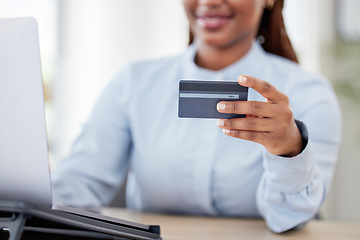 Image showing Woman, hand and credit card by laptop, office and typing with click, easy payment and online shopping. Employee, person or girl with banking, computer and e commerce with finance, choice or budget