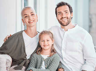 Image showing Mother, father and girl on couch, portrait and smile with care, bonding and hug for love in home living room. Mom, dad and child with happy embrace on lounge couch, relax and pride in family house