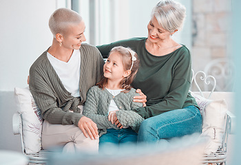 Image showing Mother, grandmother and girl with talk, sofa and hug for care, bonding or love in family home lounge. Elderly lady, kid and mom for embrace with smile, relax or together on living room couch in house