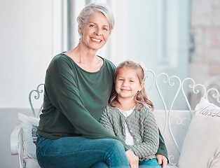 Image showing Senior grandma, child and portrait on sofa with hug, care and bonding with love, lounge and family home. Elderly woman, girl and embrace with smile, relax and together on living room couch in house