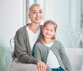 Image showing Mother, girl kid and portrait on couch, smile and hug for care, love and bonding on vacation in family house. Mama, child and happy together for embrace with pride, relax and holiday at apartment