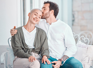 Image showing Couple, hug and kiss on sofa with smile, care and bonding with love, memory and sitting in home living room. Man, woman and happy together with embrace on lounge couch, relax and pride in apartment