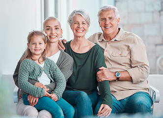 Image showing Grandparents, girl and mother in portrait on couch with hug, care or bonding with love in family home lounge. Elderly people, kid and mom with smile, relax and together on living room sofa in house