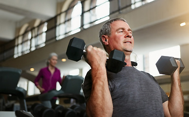 Image showing Senior fitness, gym and old man with dumbbells for weightlifting, challenge or workout, training or bodybuilding. Biceps, arms and elderly person with hand weight for strength, mindset or exercise