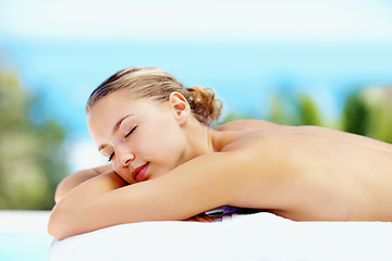 Image showing Woman, sleeping and outdoor on bed at spa for health, wellness or recovery with rest, peace or quiet. Girl, sunshine and resort for rehabilitation, calm or physical therapy treatment for body fatigue