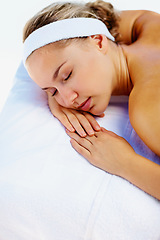 Image showing Spa, massage and woman sleeping ready for back care for wellness and health in a salon. Resort, masseuse table and calm female person with zen and pamper treatment for beauty and stress relief