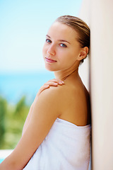 Image showing Woman, spa and outdoor with skincare, health or hands with face for results with blue sky background. Girl, touch skin and facial change in portrait, beauty and transformation for wellness in nature