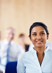 Image showing Businesswoman, smile and listen to presentation at audience, conference or seminar in boardroom. Indian person, female manager and formal fashion with excitement for speaker, discussion or panel