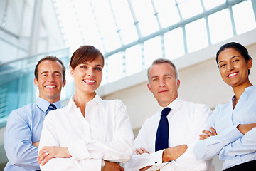 Image showing Portrait, smile and business people with arms crossed, confident or support with coaching, corporate training or professional. Face, group or manager with employees, solidarity or low angle with joy