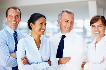 Image showing Business people, professional and happy team in confidence at office for leadership or management. Group of executive employees or staff smile with arms crossed in teamwork or success at workplace