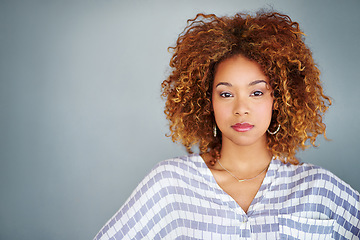 Image showing Portrait, confident and creative business woman isolated on a gray background mockup space. Serious face, professional and designer, entrepreneur or young employee at startup office in South Africa