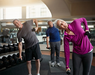 Image showing Senior fitness club, stretching and people with dumbbells at gym for training, wellness or exercise. Class, workout and elderly men with personal trainer for weightlifting, support or bodybuilding