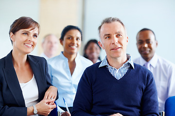 Image showing Businesspeople, audience and listen to presentation at conference, workshop or seminar in New York. Diverse group, man and woman with excited expression for discussion, speaker or panel in boardroom