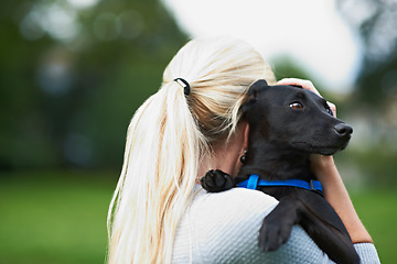 Image showing Woman, dog and animal love at outdoor park for together bonding, training on backyard grass. Female person, pet and hug puppy as owner for health exercise or relax in garden, care trust or friendship