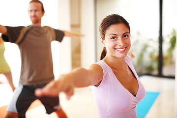 Image showing Portrait, smile and stretching, woman in yoga class for fitness, commitment and body wellness. Pilates, men and women in gym together for holistic health, mindfulness and happy girl at exercise club.
