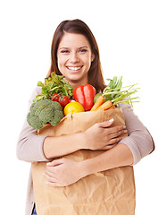 Image showing Portrait, vegetables and woman with nutrition, brown bag and girl isolated on white studio background. Face, person or model with healthy food, vegan or diet plan with mockup space, happy or wellness