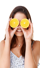 Image showing Happy woman cover face with orange fruits in studio for detox, vegan diet and natural skincare on white background. Girl, citrus food and healthy nutrition for sustainable benefits, vitamin c or glow