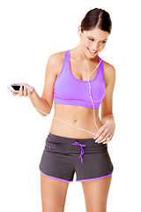 Image showing Woman, face or music in studio for fitness, workout or exercise with sportswear, earphones and smile. Person, thinking or happy for radio, audio or podcast with mockup or training on white background