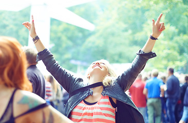 Image showing Woman, dancing and happy outdoor at music festival for freedom, performance and entertainment with crowd. Person, cheering and smile at event, concert or show with audience in nature for summer party