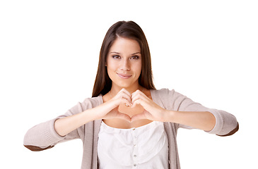 Image showing Heart hands, portrait and woman in studio with support, hope or kindness icon on white background. Love, emoji and face of female model with thank you sign for donation, charity or gratitude gesture