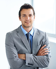 Image showing Portrait, arms crossed and business man in company, corporate office or workplace pride. Face, professional employee and confident lawyer in suit, attorney or consultant working at law firm in Spain