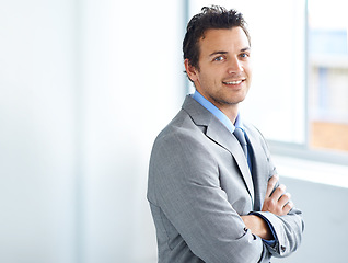 Image showing Portrait, smile or business man with arms crossed in workplace, corporate office or company. Face, professional employee or confident lawyer in suit, attorney pride or worker in Spain on mockup space