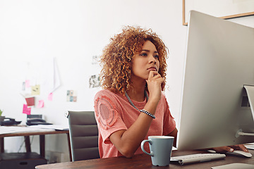 Image showing Designer, thinking or worker with computer for research, editing or copywriting on blog or website. Startup, agency or African woman in office working on internet update, networking or reading news