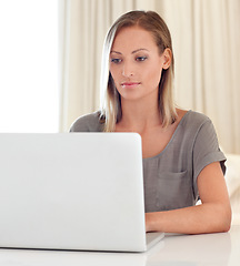 Image showing Woman, laptop and remote work from home with typing, click and thinking for freelance copywriting job. Girl, computer and entrepreneur with analysis, schedule or brainstorming for ideas in apartment