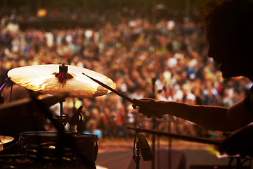 Image showing Drummer, music and crowd at stage, concert or musician in performance at festival or event with fans. Playing, rock or man on drums in a metal band with audience listening to beat, sound or show