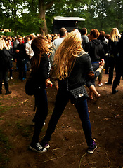 Image showing Friends, dancing and fun at outdoor music festival, party and freedom or energy at concert. Women, back and crazy at event, entertainment and bonding outside for friendship, crowd and rave or fashion