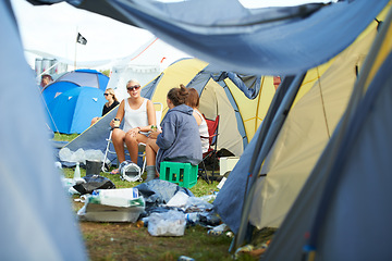 Image showing Camping, tent and friends with drinks at a festival, event or group in conversation with garbage on ground. People, talking and relax with beer at party in summer, vacation or travel on holiday