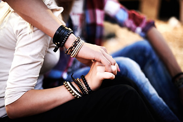 Image showing Love, date and a couple holding hands at a music festival outdoor together closeup for romance or bonding. Party, concert or event with a man and woman in the audience or crowd for a carnival show