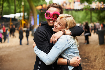 Image showing Happy couple, hug and outdoor festival for love, care or support at crowded party, DJ event or music park. Man and woman smile in embrace, affection or trust for festive celebration or summer break