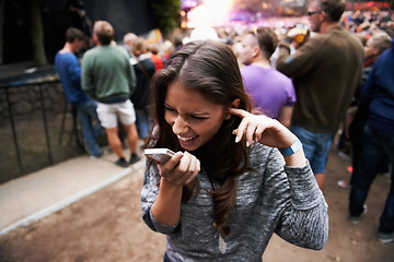 Image showing Music festival, event and woman outdoor with phone call, conversation and noise from concert, crowd or party. Contact, person and confused by loud, sound or listening to smartphone and lost at a rave