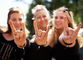 Image showing Friends, portrait and women with rocker hands at a music festival, concert of party outdoor together. Devil horns, emoji and face of female group outside for fun, celebration and rock event in a park