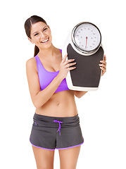 Image showing Scale, portrait and happy woman with exercise, weight loss and smile from health progress. Workout, fitness and sport training of a female person in studio with white background and wellness care