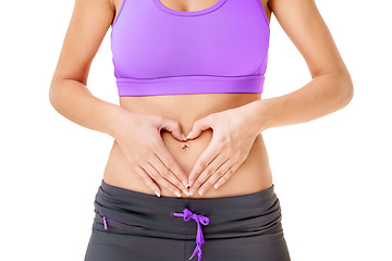 Image showing Woman, heart hands and stomach for care in studio with gut health in digestion mock up on white background. Female person, gesture or abdomen for wellness of body, diet and nutrition by balanced meal