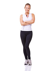 Image showing Portrait, woman and arms crossed for fitness, studio and happy with exercise wellness in gym clothes. Model, usa and smile face with commitment to health body, training and relax by white background