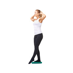 Image showing Balance, health and body with woman on disk in studio for workout, fitness or exercise. Wellness, challenge and training with female person on white background for flexibility, smile or aerobics