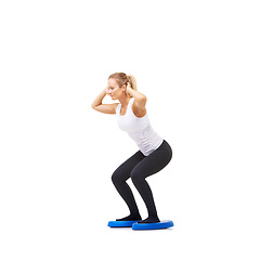 Image showing Balance, exercise and fitness with woman on disc in studio for workout, mindfulness or squats. Wellness, challenge and training with person on white background for flexibility, smile or aerobics