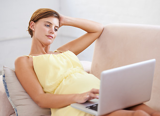 Image showing Thinking, pregnant and woman on laptop in house living room for childcare website, information and reading. Vision, ideas and relax person on home sofa with technology, research and pregnancy blog