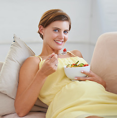 Image showing Pregnant woman, salad and portrait on sofa for health, nutrition or wellness in living room of apartment. Person, vegetables or happy on couch of lounge for relax, pregnancy or healthy diet and fiber