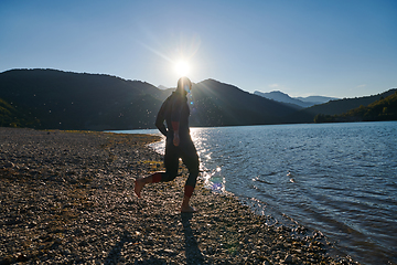 Image showing Triathlon athlete starting swimming training on lake