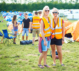 Image showing Portrait, sunglasses and event staff at festival for music, party and carnival outdoor in summer. Happy women, girls camping and security team in headset, safety vest or celebration concert in nature