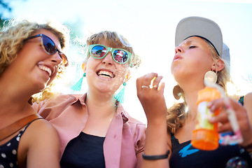 Image showing Blowing bubbles, women and outdoor with friends, happiness and sunshine with fun, playing and bonding together. People, festival and group with carefree, excited and celebration with weekend break