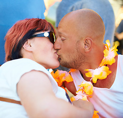 Image showing Love, couple and kiss together outdoor, care or connection in healthy relationship at music festival. Lips touch, man and woman in romance, face profile or flowers at carnival party in summer on date